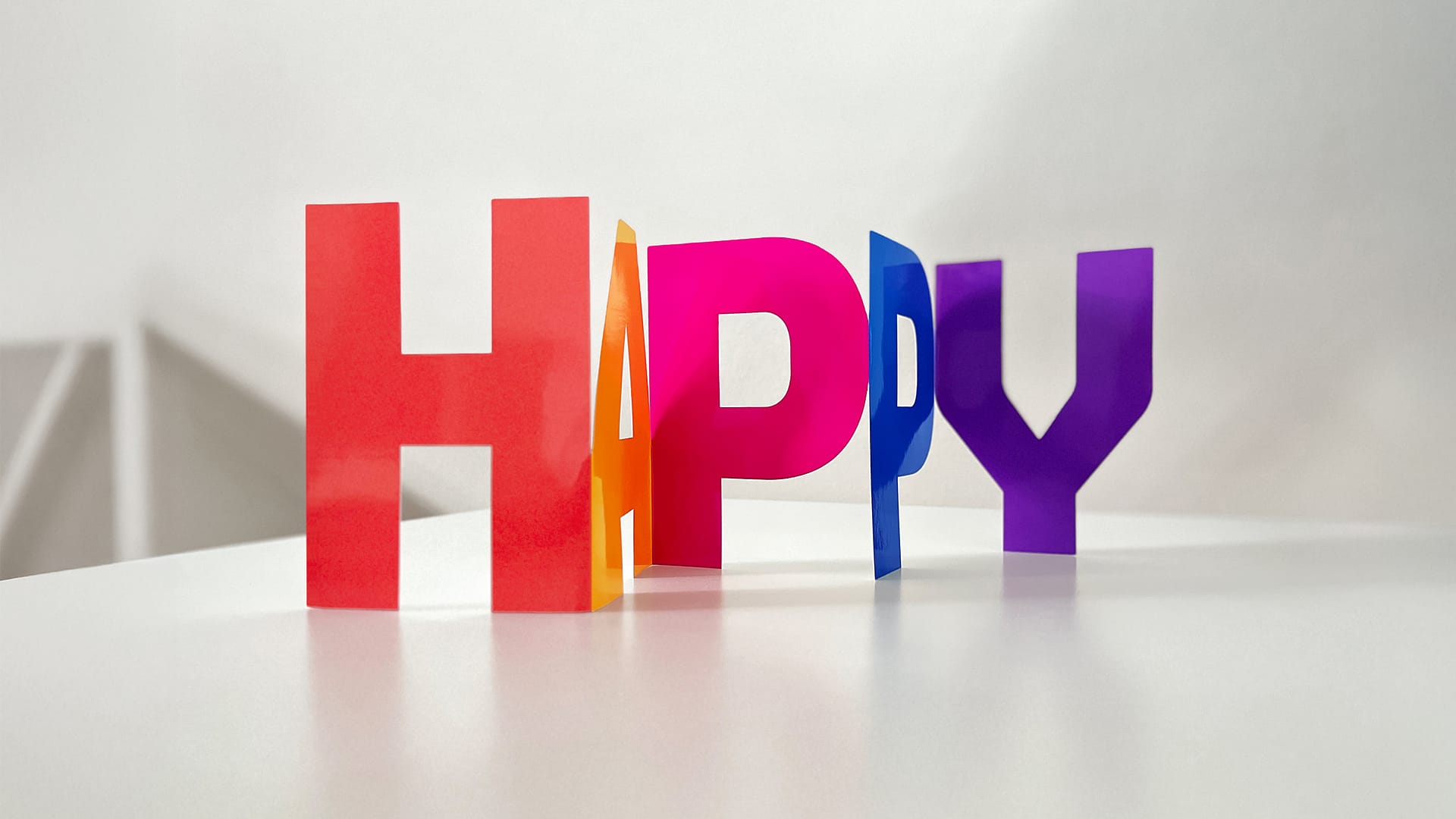 HAPPY-Karte für eightbit experts – Corporate Design von BEING BORN als farbiges Symbol für gelebte Unternehmenskultur.